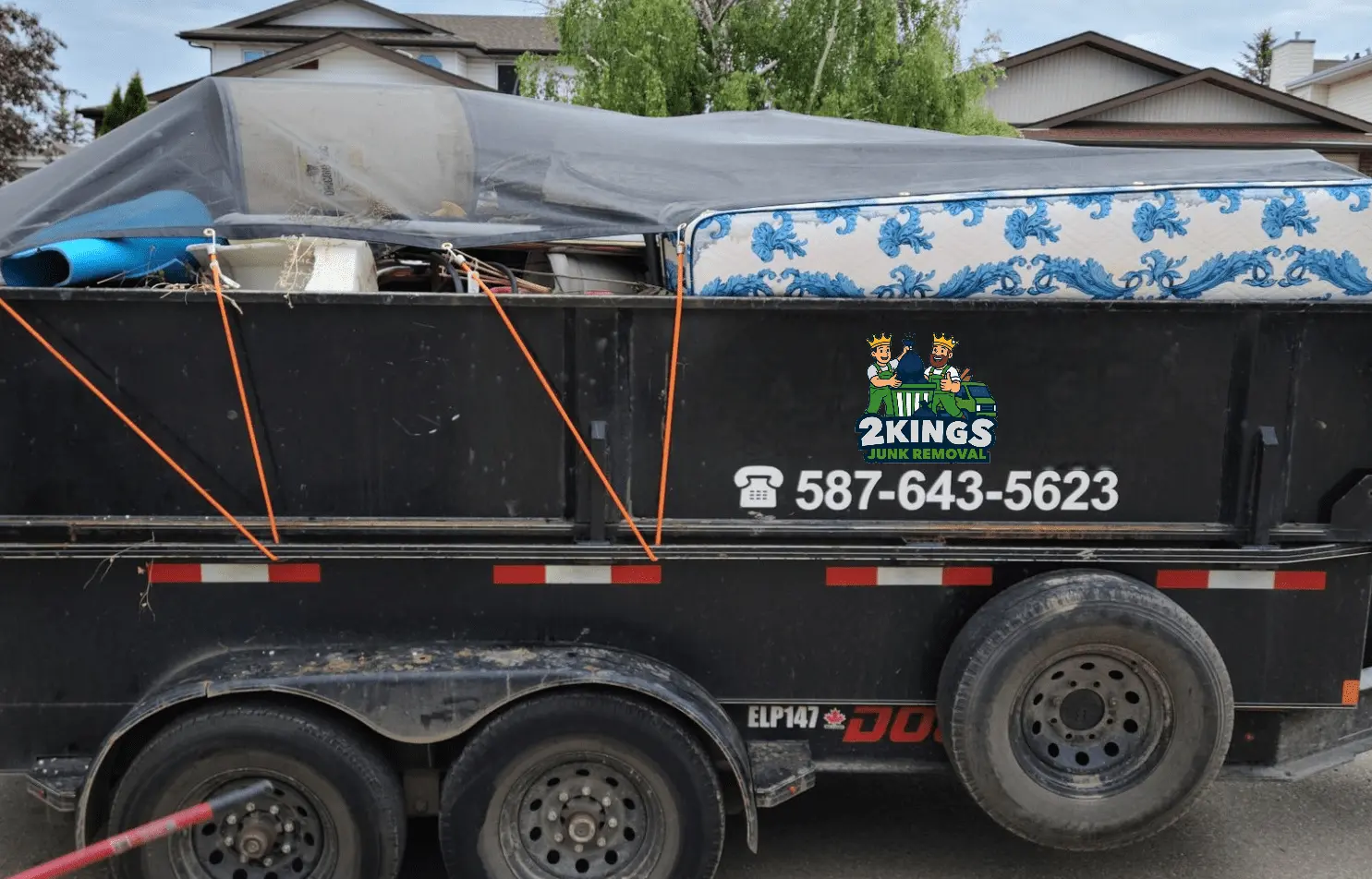 2Kings Junk branded truck loaded with household junk