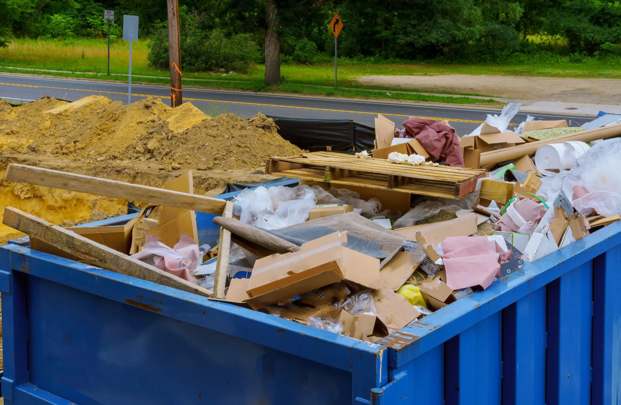 Emergency junk removal crew clearing debris from an Edmonton property.